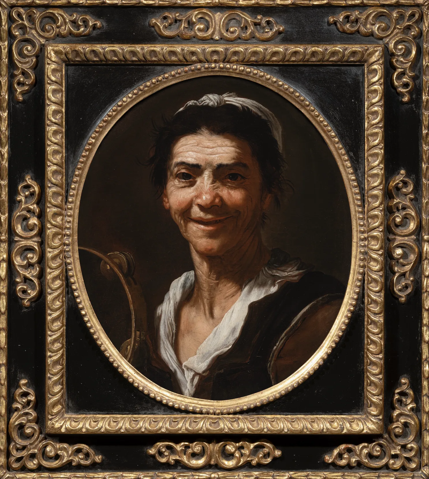 An Elderly Woman with a Tambourine (The Sense of Hearing) by JUSEPE DE RIBERA, CALLED LO SPAGNOLETTO